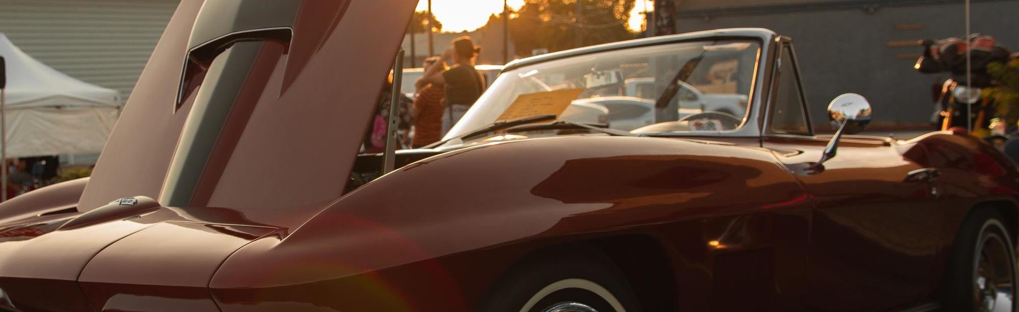 Classic red C2 Corvette stingray with hood up