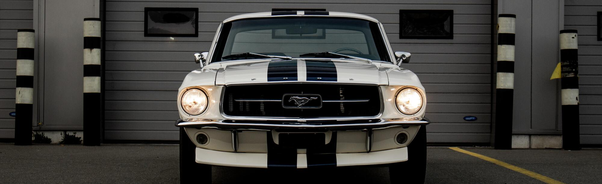 Mustang Shelby cobra in front of storage garage