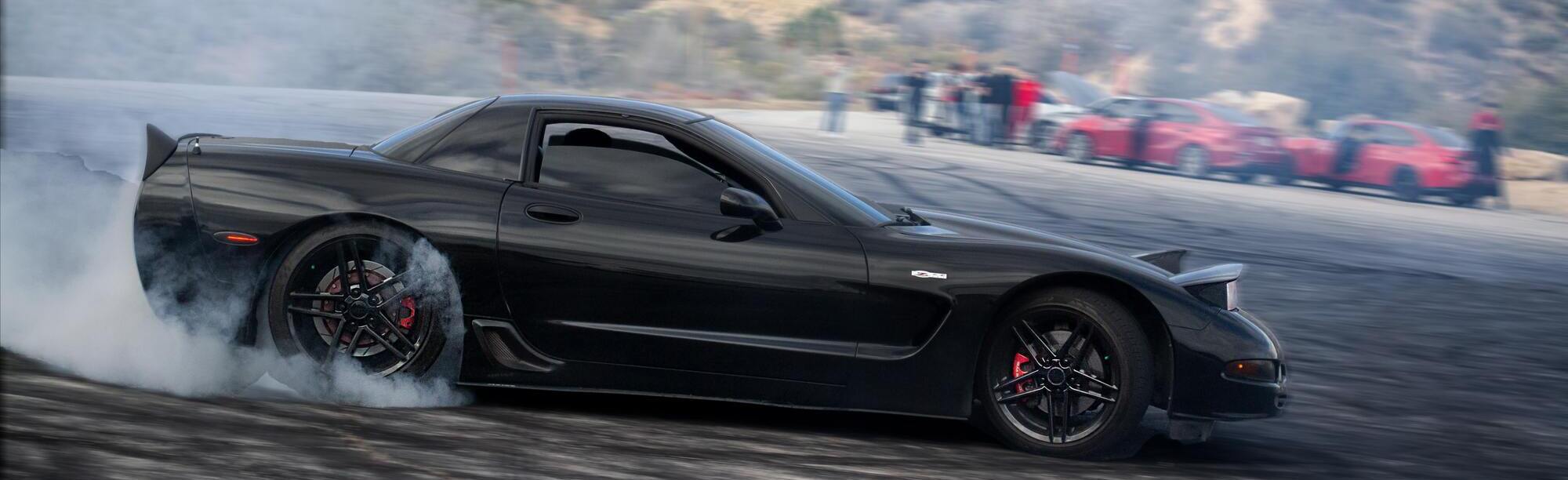 Black C5 Corvette drifting