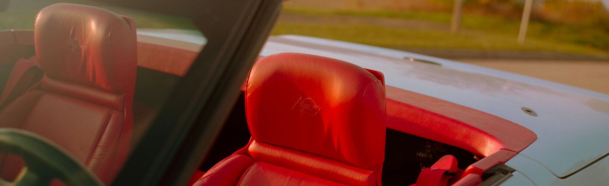 Red Corvette interior seats photographed by Connor Betts